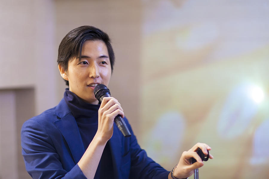 Asian Businessman Giving Presentation Photograph by Recep-bg