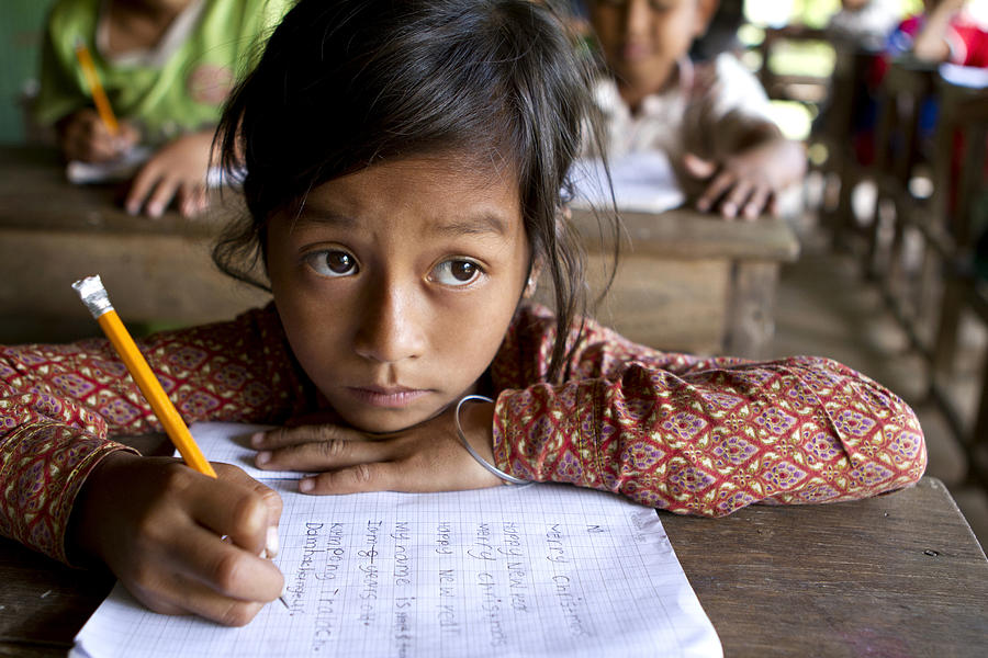Asian girl studying hard at school Photograph by Joakimbkk