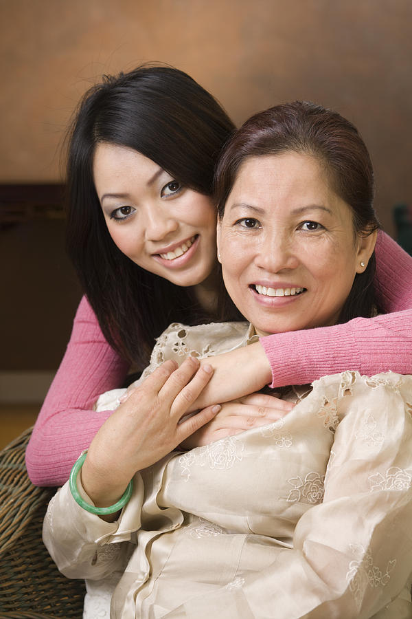 Asian Mother and Daughter, a Loving Chinese, Vietnamese Family Hugging Photograph by YinYang