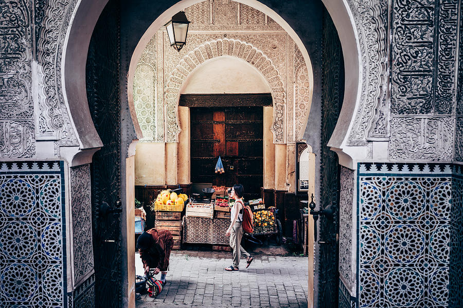 Asian woman tourist getting around in Marrakesh Photograph by Oscar Wong