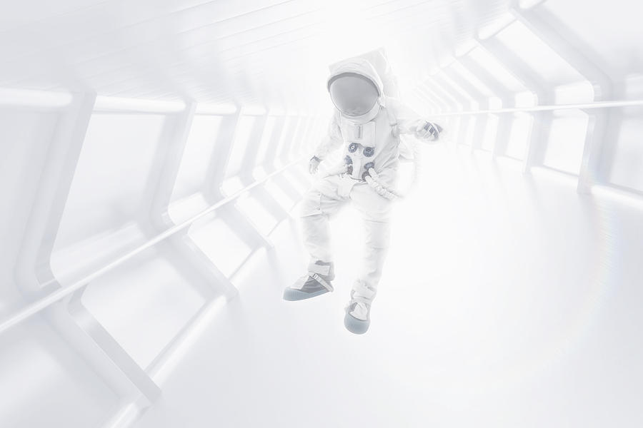 Astronaut floating through tunnel Photograph by Tim Bird