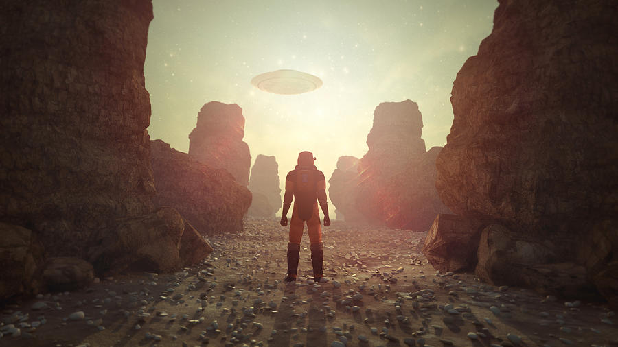 Astronaut on distant planet discovering UFO Photograph by Matjaz Slanic