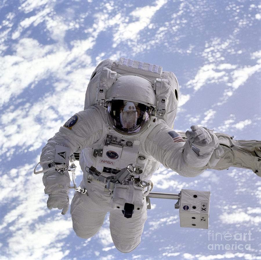 Astronaut on spacewalk Photograph by Celestial Images