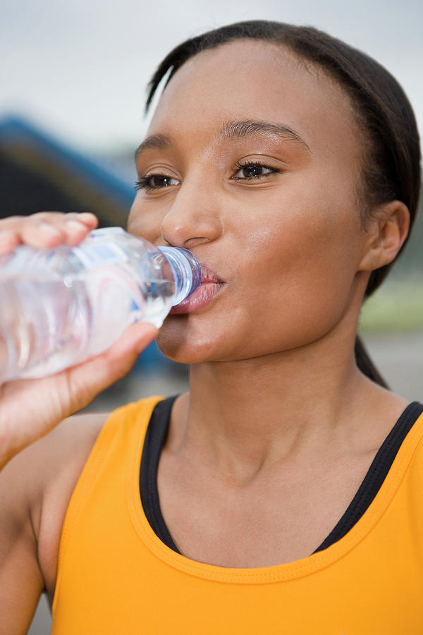 Athlete Drinking Water Photograph by Gustoimages/science Photo Library