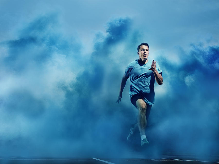Athlete Running In Blue Smoke Photograph by Henrik Sorensen