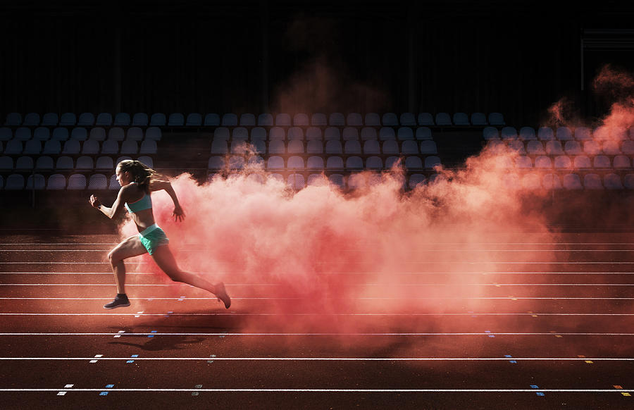 Athlete Running In Red Smoke Photograph by Henrik Sorensen
