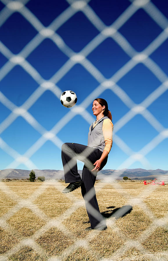 Attractive Woman Juggling A Soccer Ball Photograph By Corey Rich