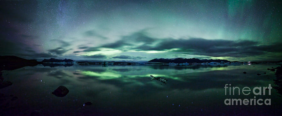 Aurora borealis over glacial lagoon in Iceland Photograph by Matteo Colombo