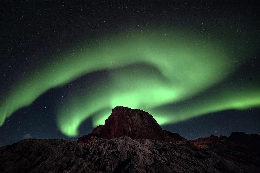 Aurora Spins And Twists Photograph by Tommy Johansen. Freelance Photographer In Lofoten Norway.