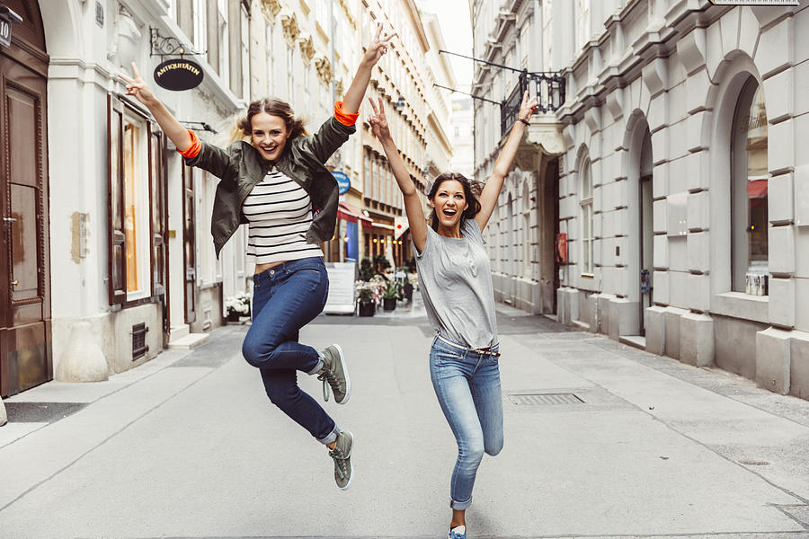 Austria, Vienna, two excited female friends in the old town Photograph by Westend61