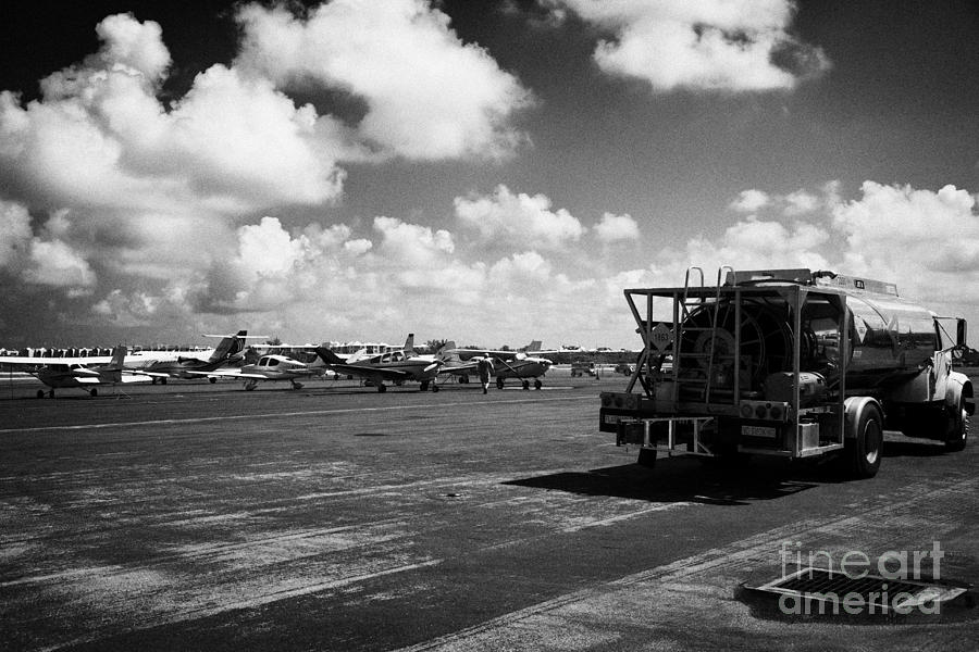 Key Photograph - Avfuel Aviation Fuel Supply Truck And Range Of Private Aircraft At Small Key West International Airp by Joe Fox