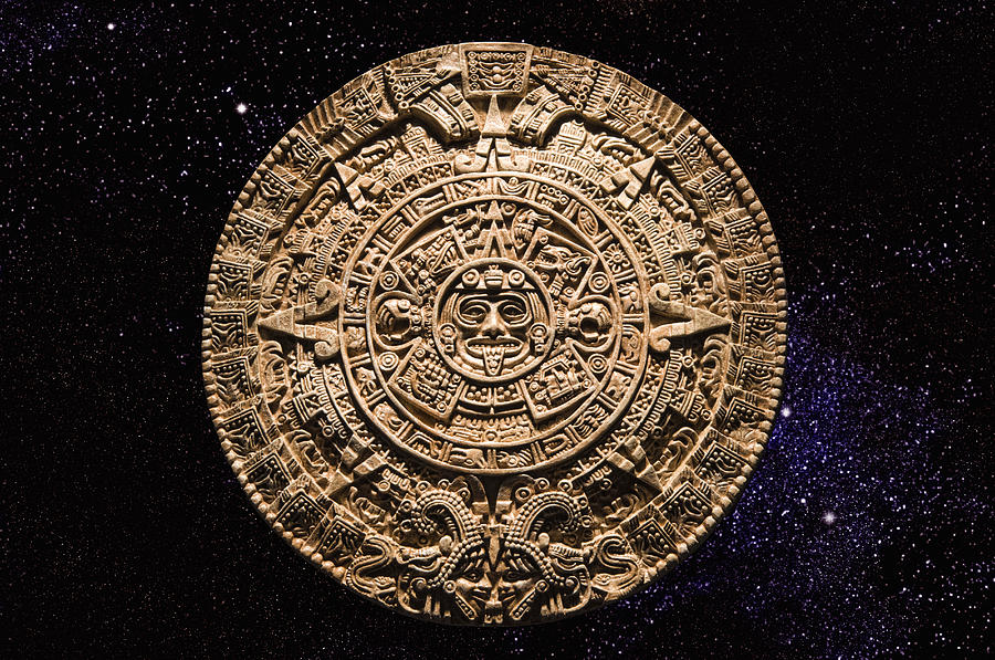 Aztec calendar stone carving in space Photograph by Blend Images - PBNJ Productions