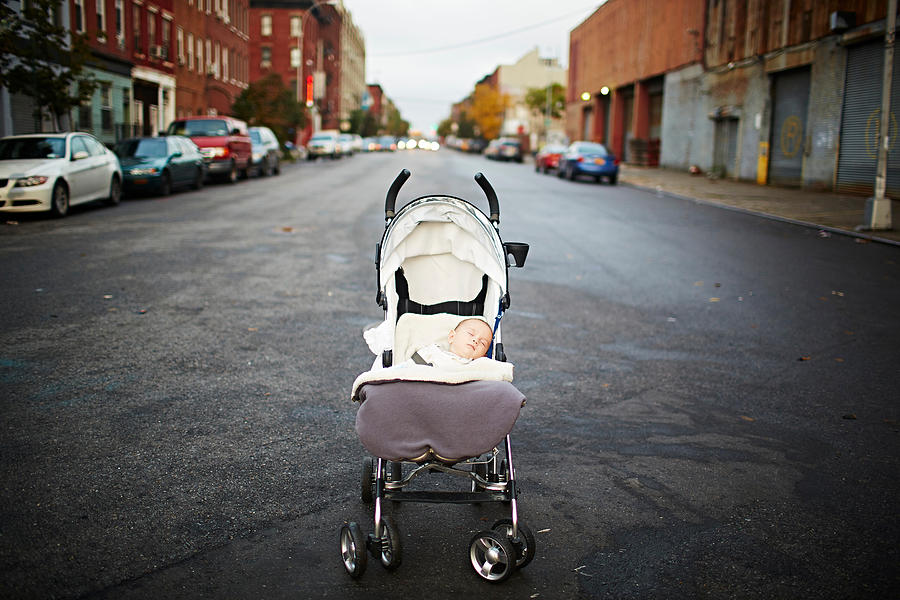 Baby boy asleep in push chair in middle of street Photograph by Cultura/JPM Baby boy asleep in push chair in middle of street Photograph by Cultura/JPM