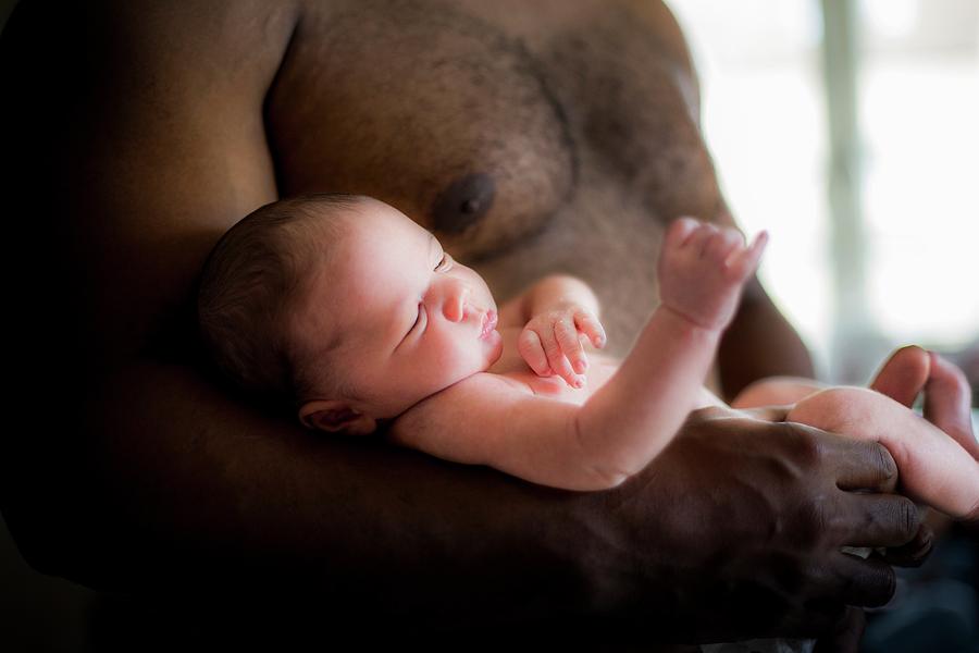 Baby Boy Being Cradled By His Father Photograph By Samuel Ashfield