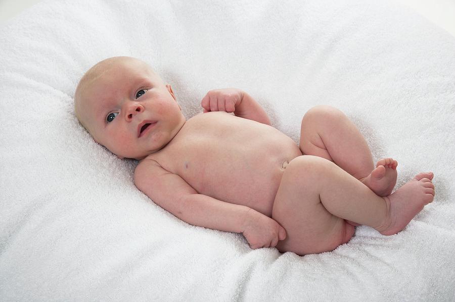 Baby Boy On A Towel by Simon Booth/science Photo Library.