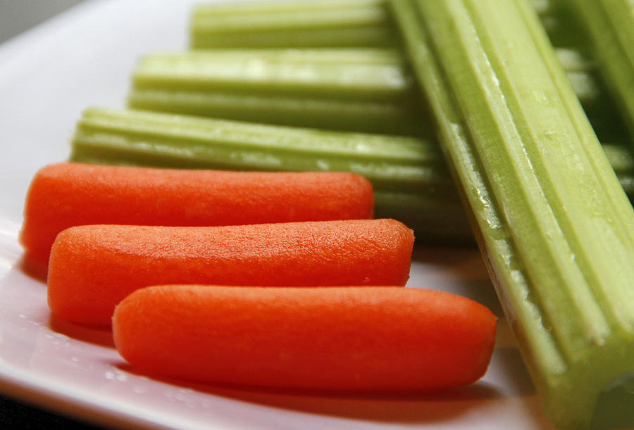 Baby Carrots And Celery Stalks Photograph by Science Source