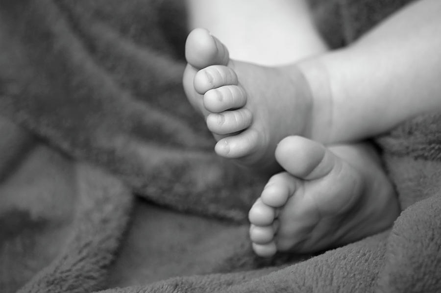 Black And White Photograph - Baby Feet by Carolyn Marshall