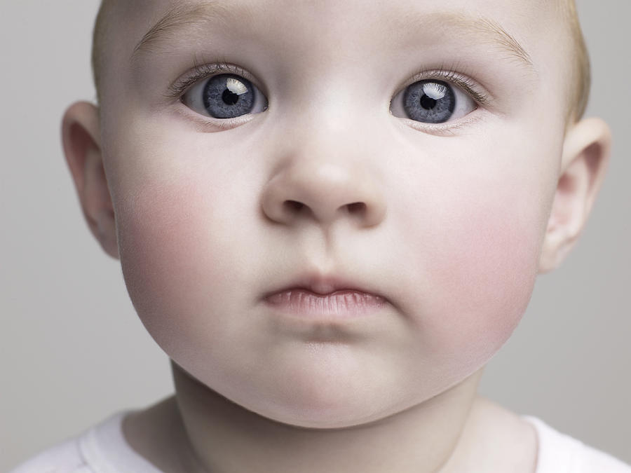 Baby girl (6-9 months), close-up Photograph by Roger Wright