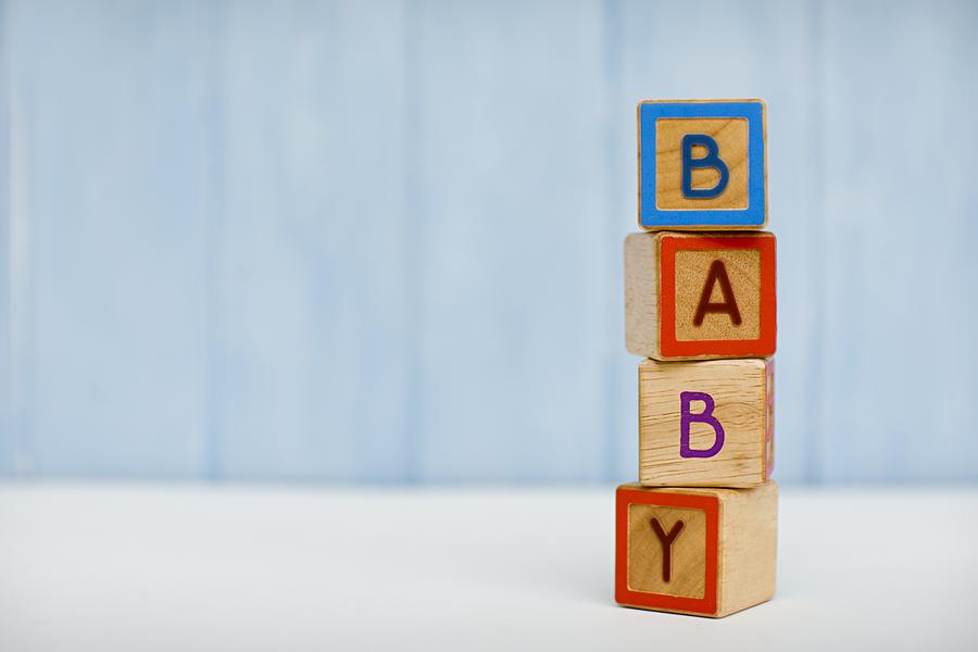 Baby spelt in building blocks Photograph by Image Source