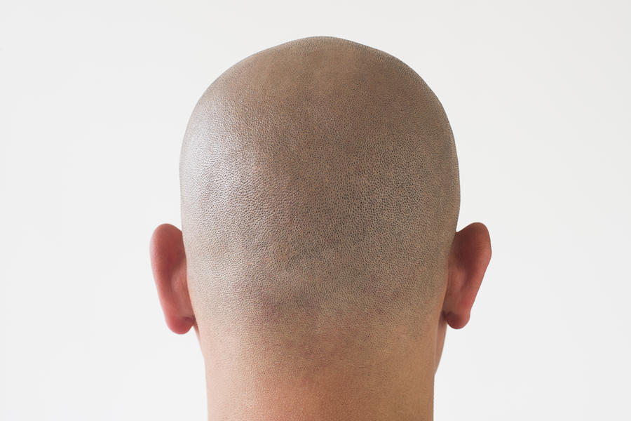 Back view of man with shaved head Photograph by Tetra Images