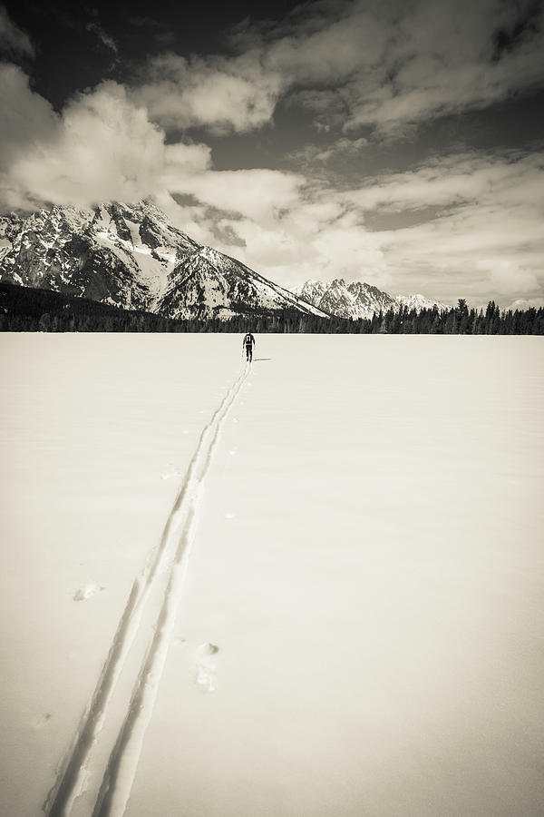 Active Photograph - Backcountry Skier Under Mount Moran by Russ Bishop Active Photograph - Backcountry Skier Under Mount Moran by Russ Bishop