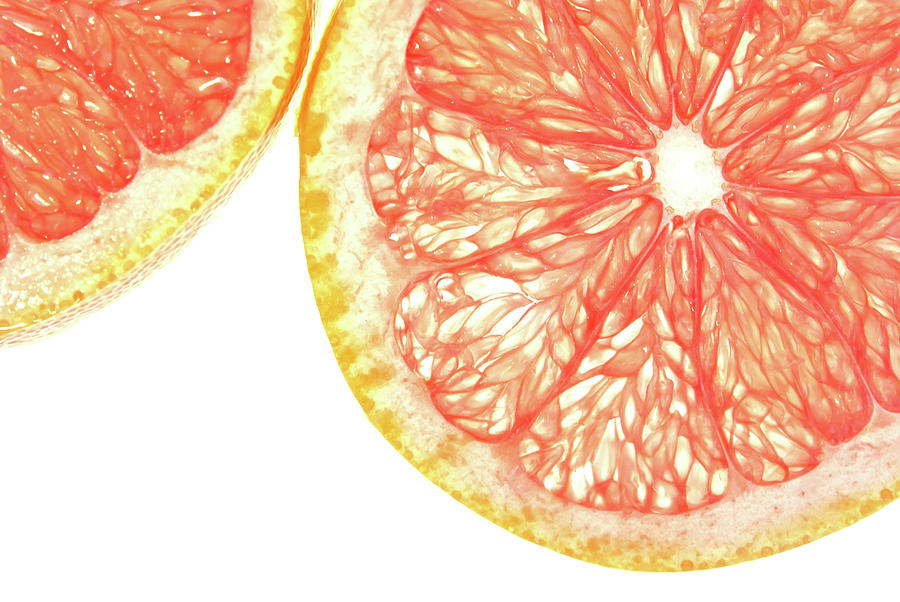 Backlit Ruby Grapefruit Slices Photograph by Stacey Macqueen