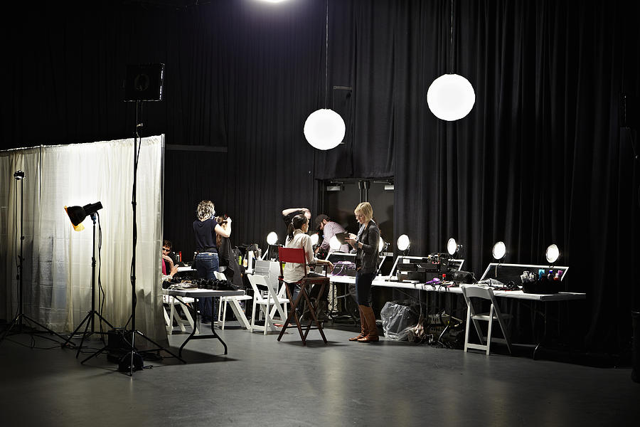 Backstage preparation area of fashion show Photograph by Thomas Barwick