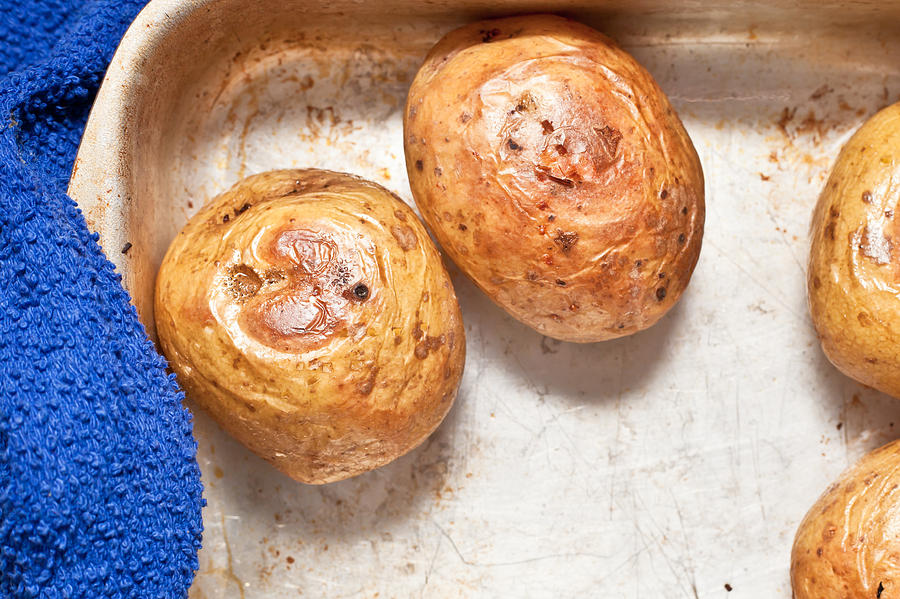 Potato Photograph - Baked potatoes by Tom Gowanlock