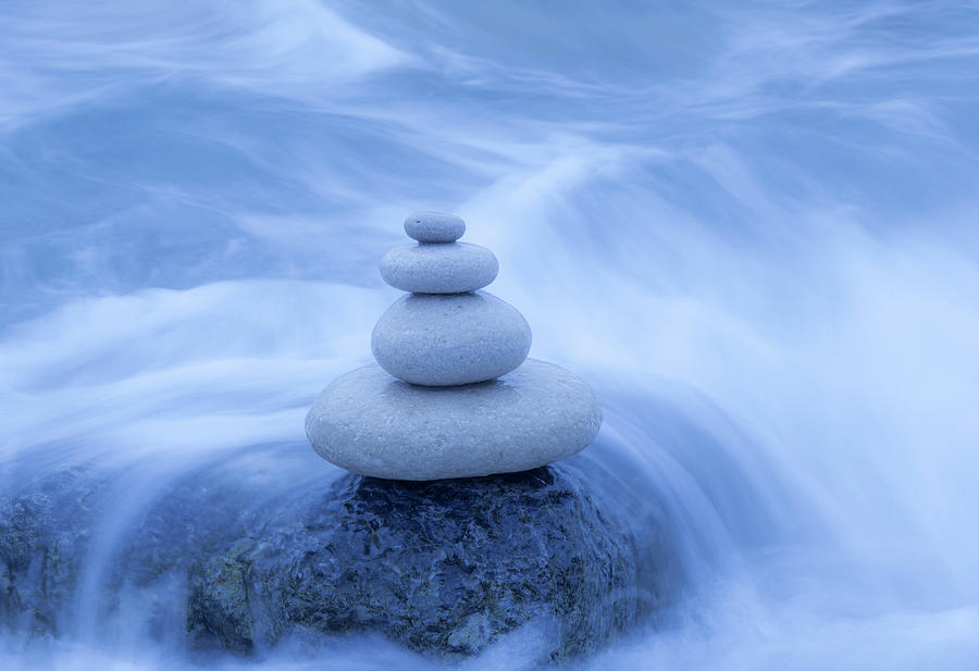 Balanced Stones On The Beach Photograph by Travelpix Ltd