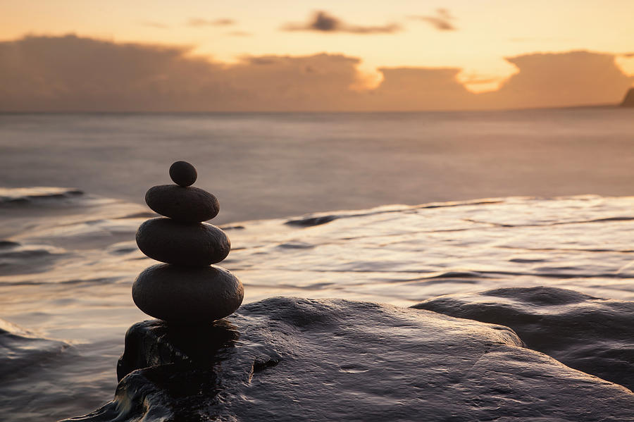 Balancing Pebbles At Sunset Photograph by Travelpix Ltd