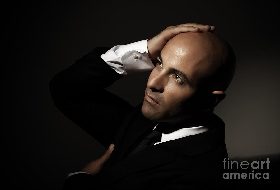Portrait Photograph - Bald man wearing black suit by Anna Om