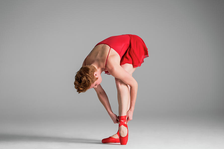 Ballerina In Red Adjusting Point Shoes Photograph by Nisian Hughes
