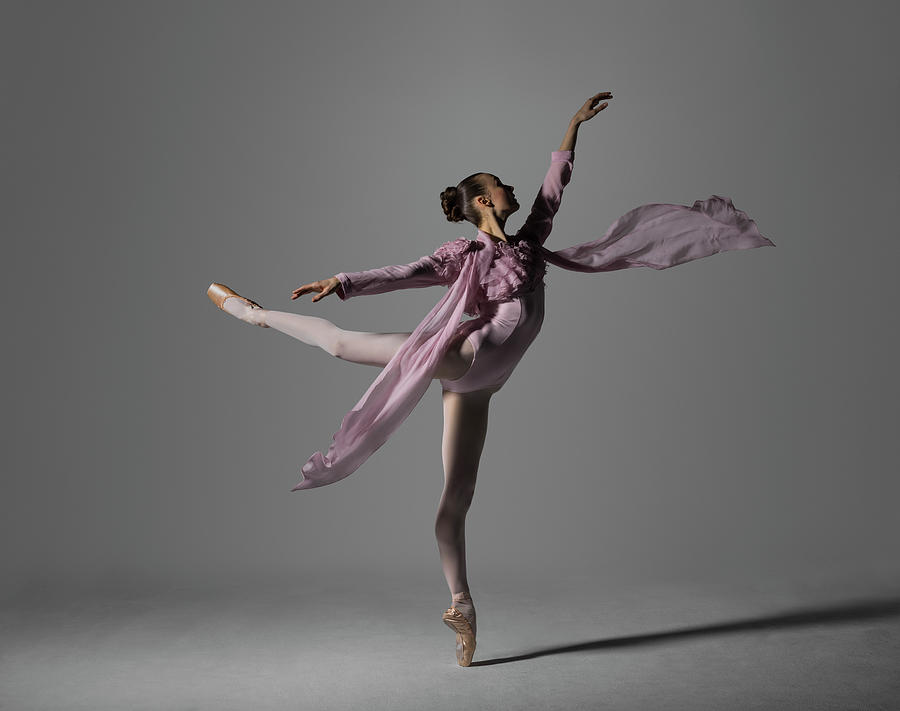 Ballerina Performing Arabesque On Pointe By Nisian Hughes