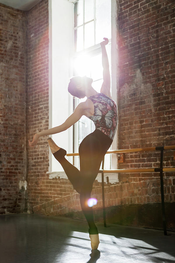 Ballerina Performing Balance On Pointe Photograph by Nisian Hughes