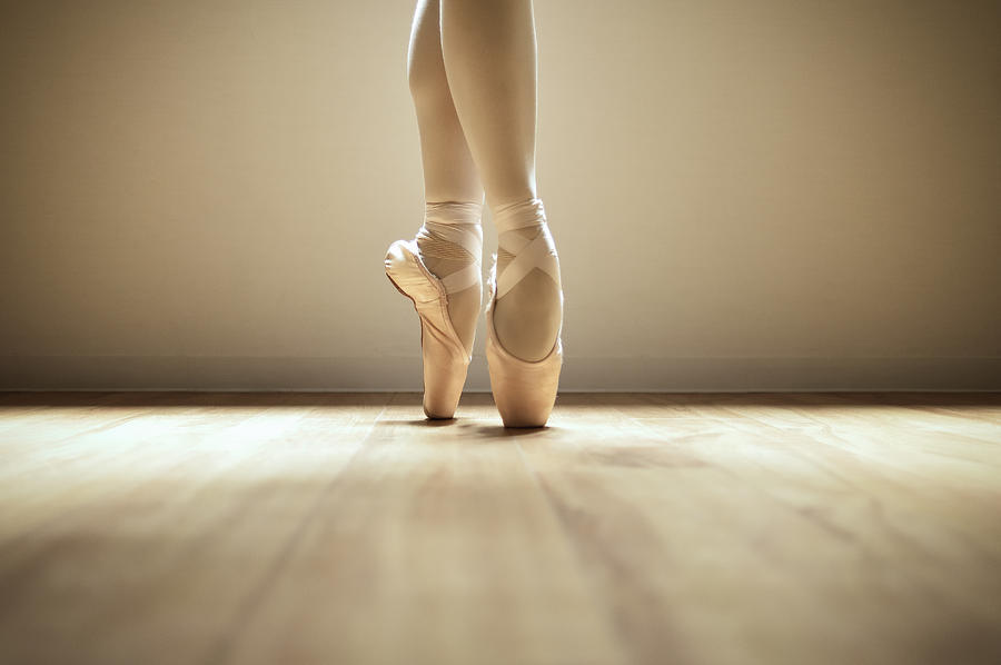 Ballerina standing on toes Photograph by Yagi Studio