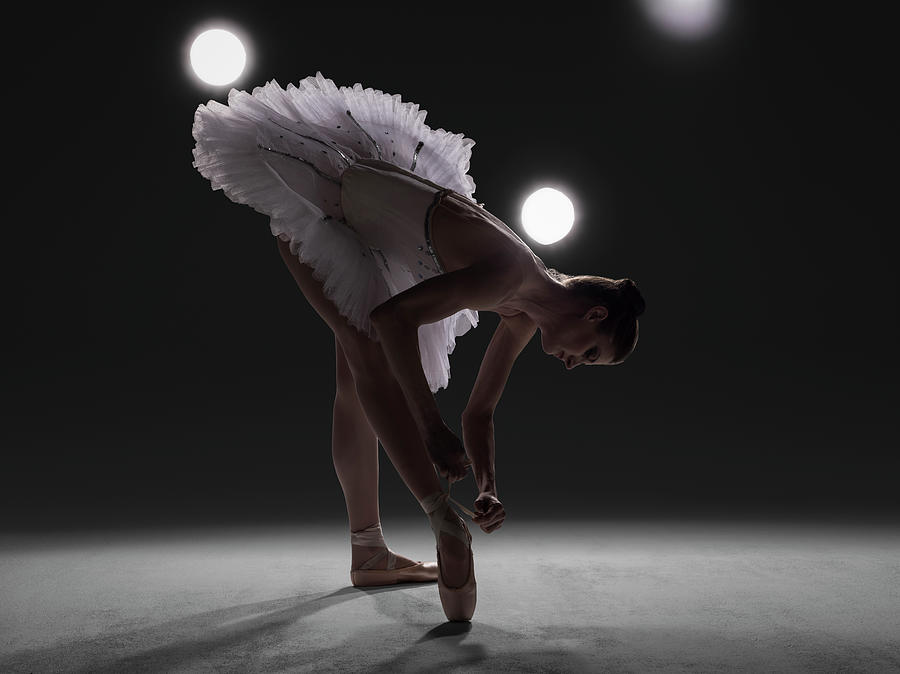 Ballerina Tying Pointe Shoe Wearing Tutu Photograph By Nisian Hughes