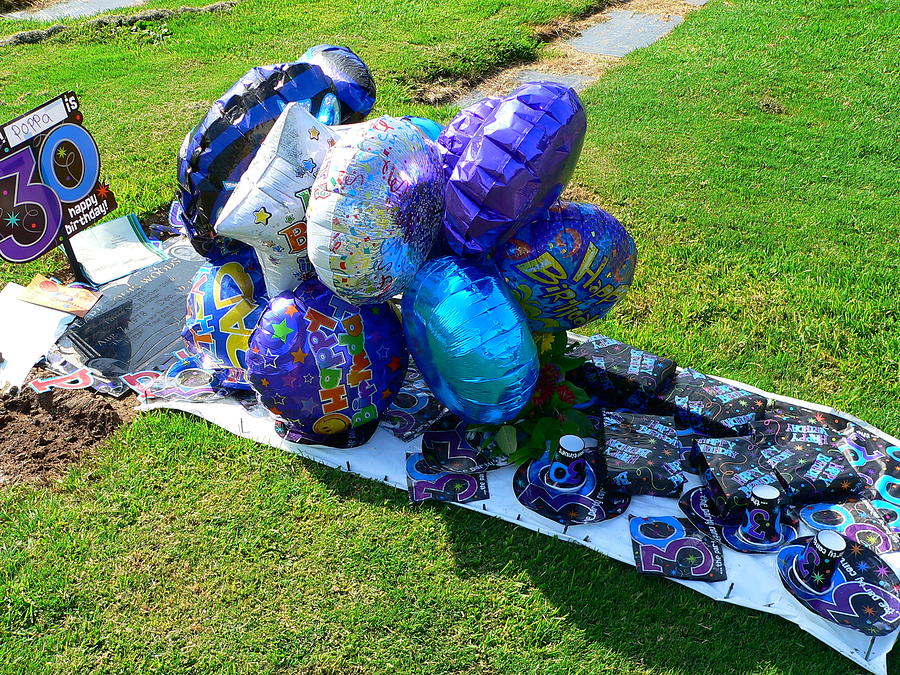 Balloon Decorated Grave Photograph by Jeff Lowe