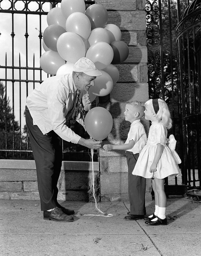 Balloon Man And Children, C.1960s Photograph by H. Armstrong Roberts/ClassicStock