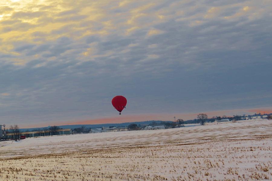 Balloon Over Snowy Field Photograph by Jeanette Oberholtzer
