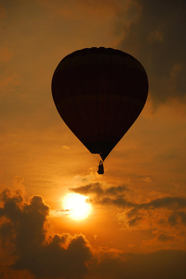 Balloon over sunset Photograph by Songquan Deng