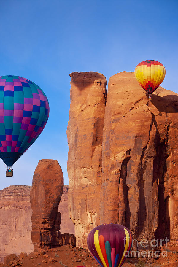 Balloons in Monument Valley Photograph by Brian Jannsen