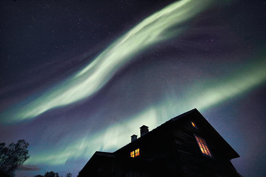 Bands of Northern Lights above an Old House Photograph by Pekka Sammallahti
