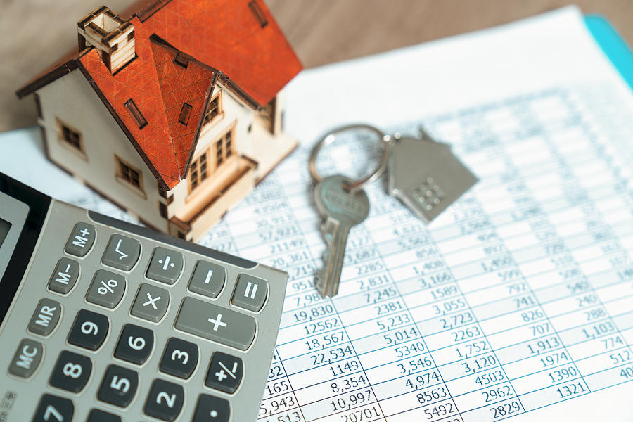 Bank Calculates The Home Loan Rate Photograph by Witthaya Prasongsin Bank Calculates The Home Loan Rate Photograph by Witthaya Prasongsin