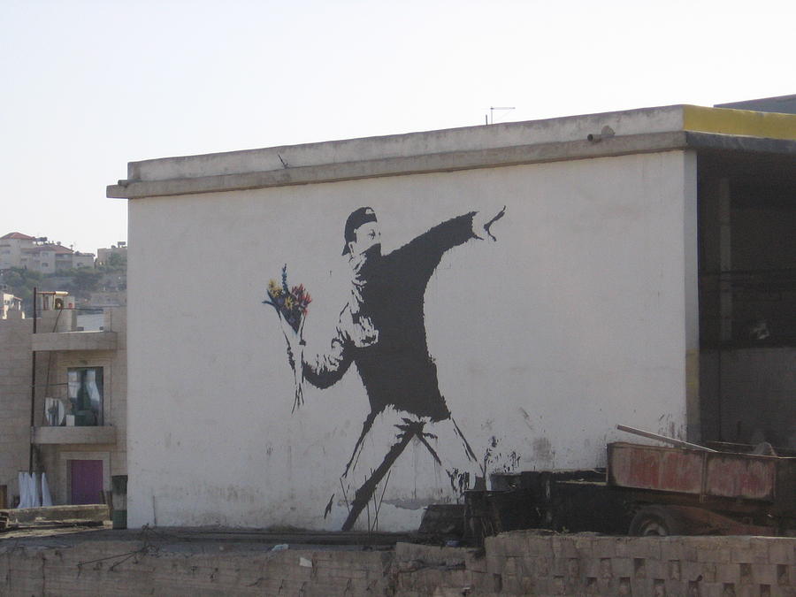 Banksy Flower Thrower In East Jerusalem Photograph by Arik Bennado