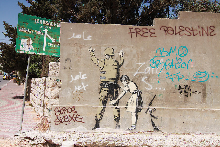 Banksy In Bethlehem Photograph by Arik Bennado