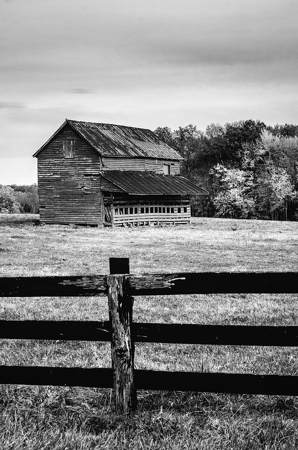 Barn and old fence Photograph by Mark Summerfield