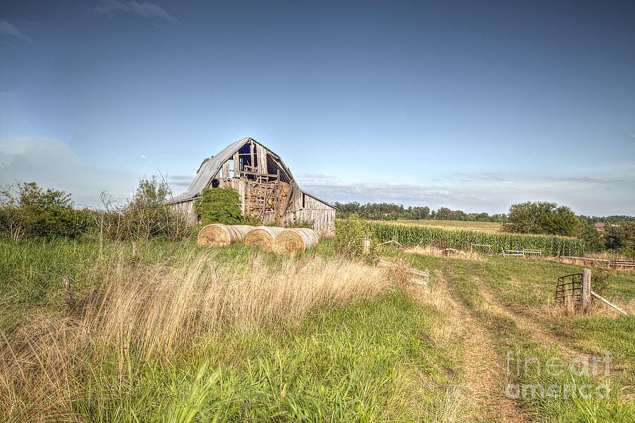 Barn in a Field with Hay Bales Photograph by Larry Braun | Pixels