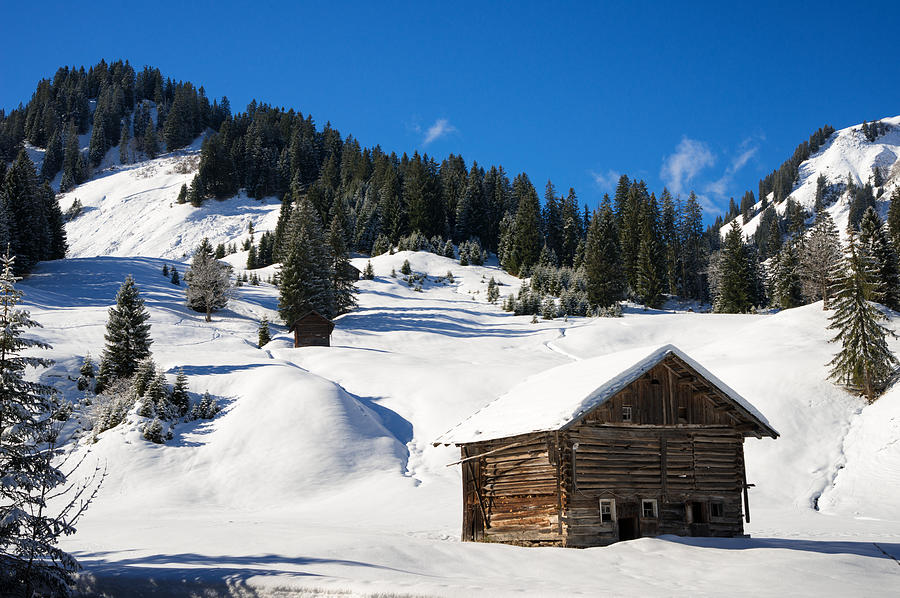 Barn in Kleinwalsertal Austria covered with snow in winter Photograph by Matthias Hauser