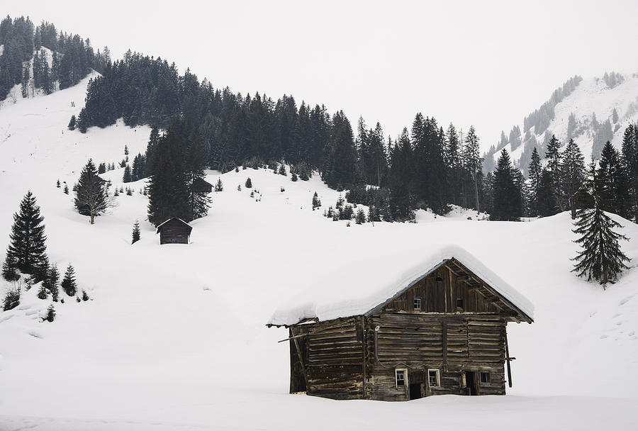 Barn in the winterly alps - beautiful mountain landscape with lots of snow Photograph by Matthias Hauser