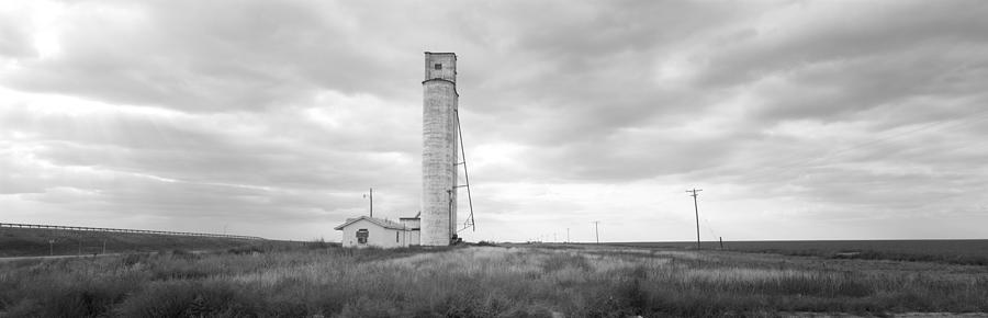 Black And White Photograph - Barn Near A Silo In A Field, Texas by Panoramic Images